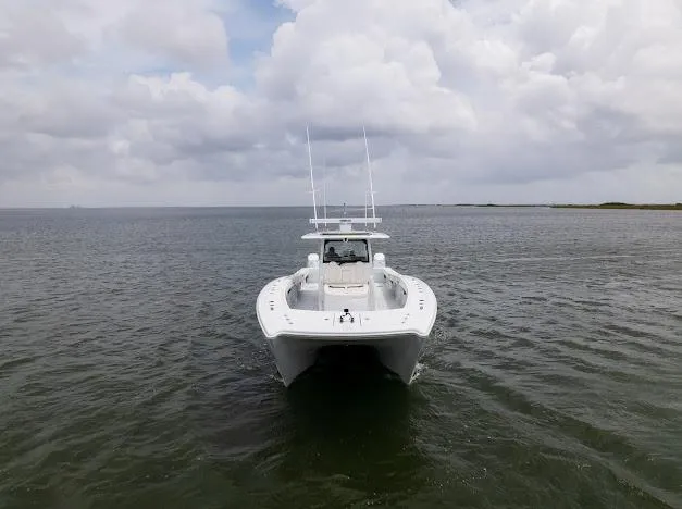 Slide: The Image of 2022 Freeman 47 boat on calm water under a partly cloudy sky. - 21