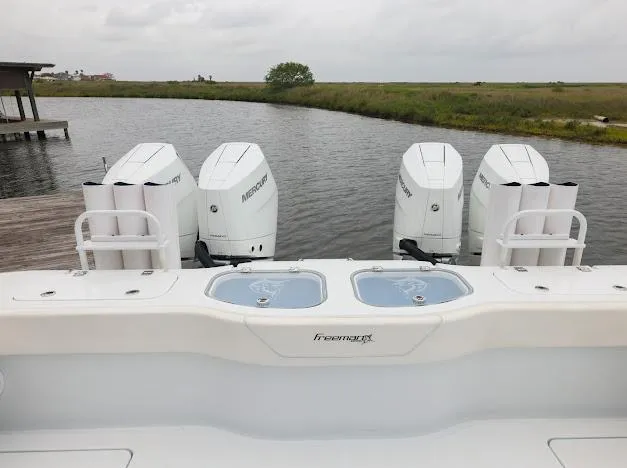 Slide: The Image of Luxury interior of 2022 Freeman 47 boat with plush seating and advanced controls. - 29