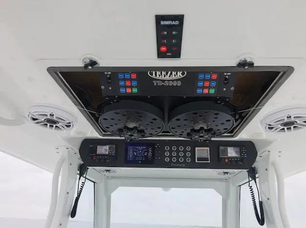 Slide: The Image of Freeman 47 boat interior, 2022 model, featuring advanced control panels and audio system. - 41