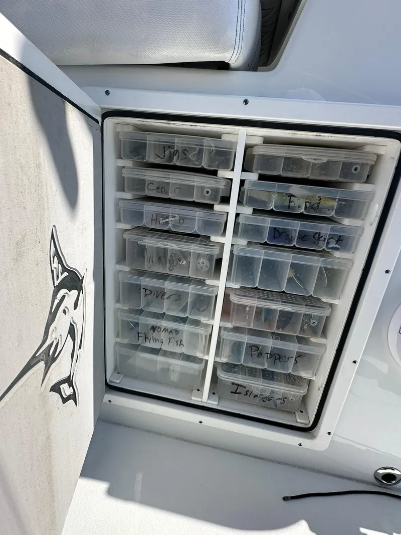 Slide: The Image of Stainless steel drawer on a 2022 Freeman 47 boat, open to reveal interior storage. - 45