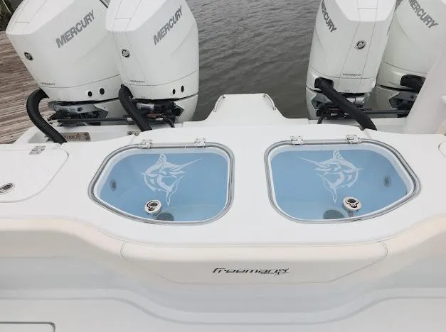 Slide: The Image of Tackle box with labeled compartments on a Freeman 47, 2022 model. - 46