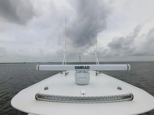 Slide: The Image of 2022 Freeman 47 boat deck with rod holders and seating, showcasing sleek design. - 50