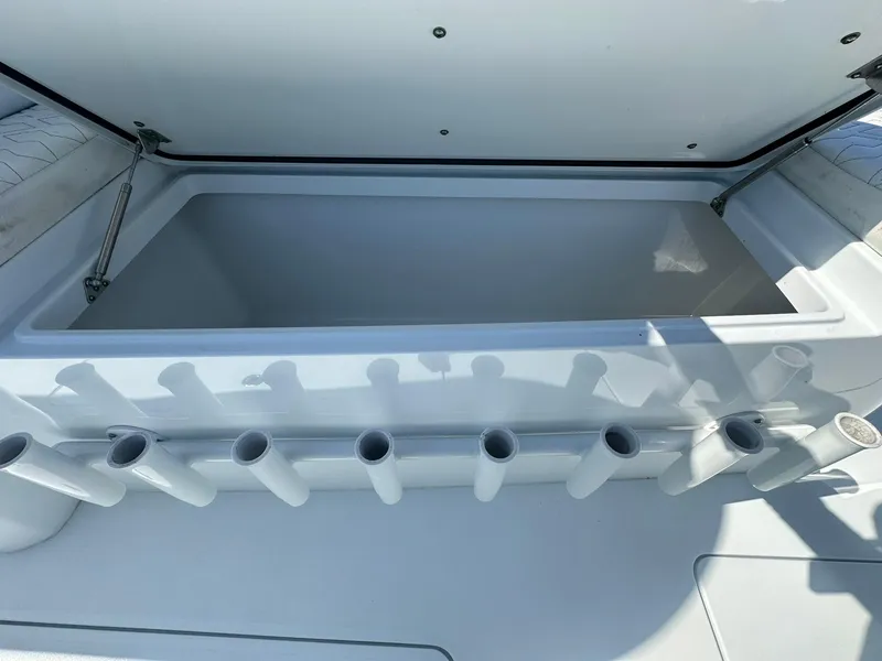 Slide: The Image of 2022 Freeman 47 boat interior with white seating and built-in speakers. - 51