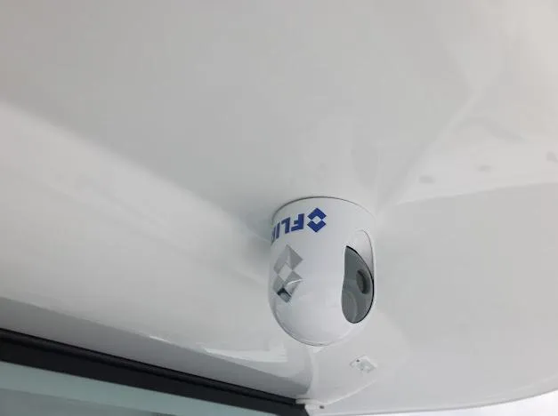 Slide: The Image of Open storage compartment on a 2022 Freeman 47 boat with rod holders. - 54