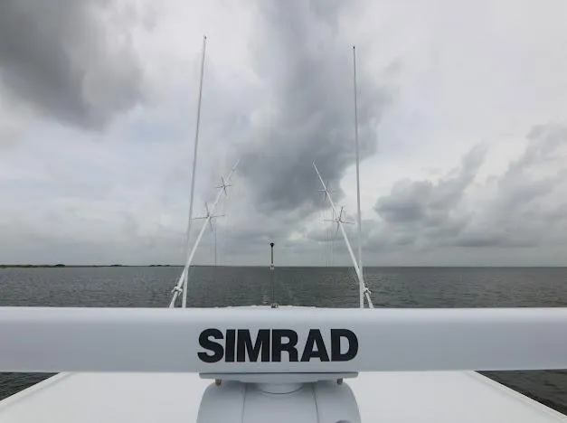 Slide: The Image of Freeman 47 boat interior, 2022 model, featuring rod holders and storage compartments. - 58