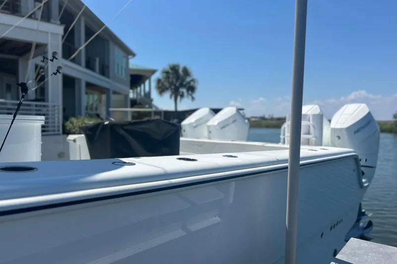 Slide: The Image of 2022 Freeman 47 boat cruising on open water under a partly cloudy sky. - 6