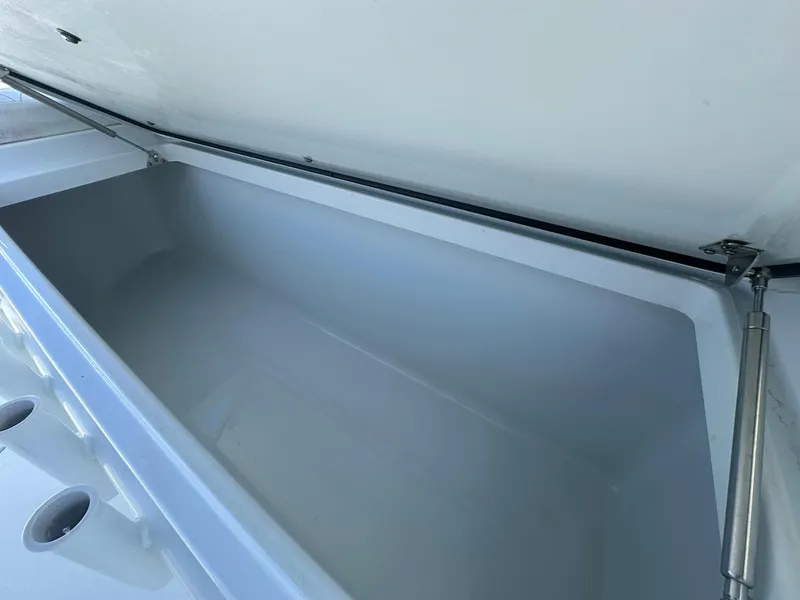 Slide: The Image of Spacious storage compartment on a 2022 Freeman 47 boat, featuring sleek white interior design. - 62