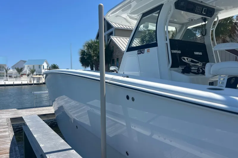 Slide: The Image of 2022 Freeman 47 boat on water under cloudy sky. - 7