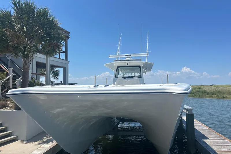 Slide: The Image of 2022 Freeman 47 boat cruising on open water under a partly cloudy sky. - 8