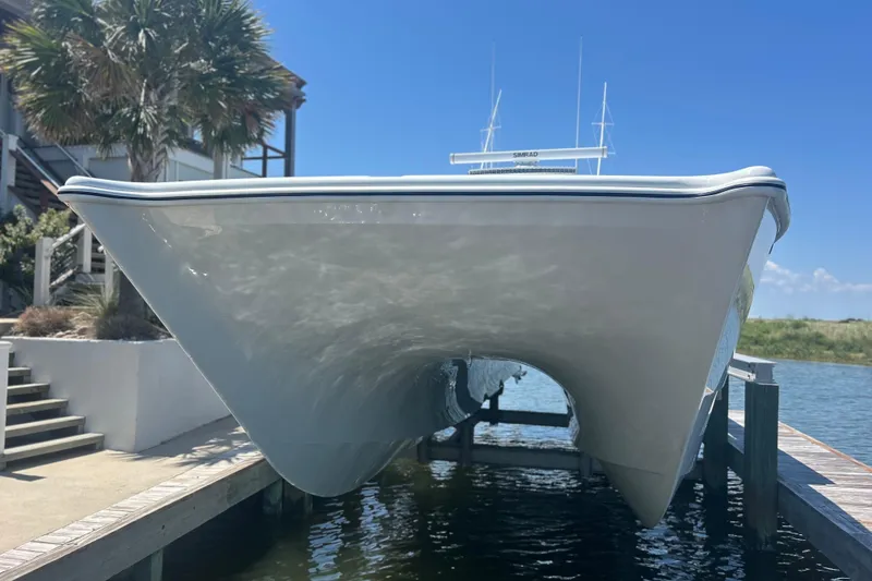 Slide: The Image of 2022 Freeman 47 boat cruising on open water under a clear blue sky. - 9