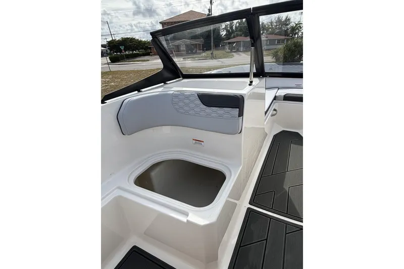 Slide: The Image of 2025 Bayliner Element M17 boat interior with seating and storage compartments. - 13