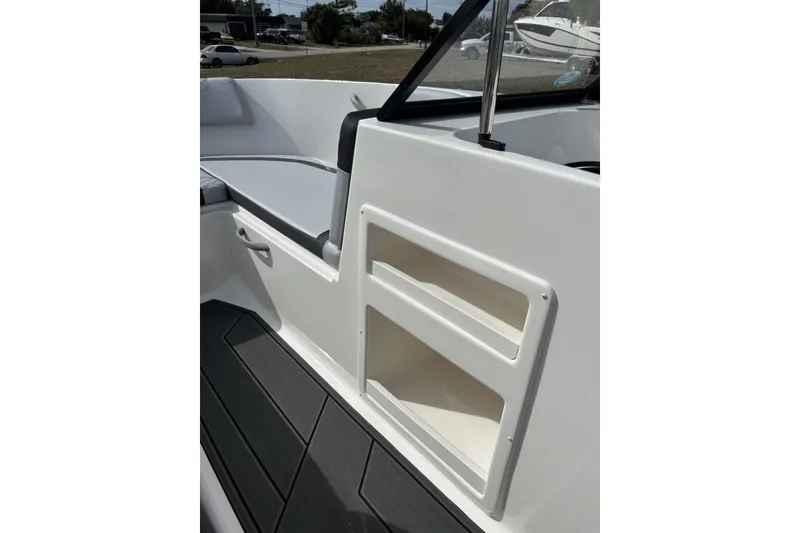 Slide: The Image of 2025 Bayliner Element M17 boat interior with seating and storage compartments. - 15
