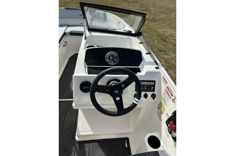 Slide: The Image of 2025 Bayliner Element M17 boat with Mercury outboard motor, featuring sleek seating and storage. - 21