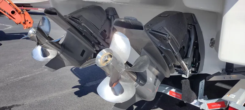Slide: The Image of 2024 Formula 290 BR boat propellers on a trailer, showcasing dual outboard engines. - 10