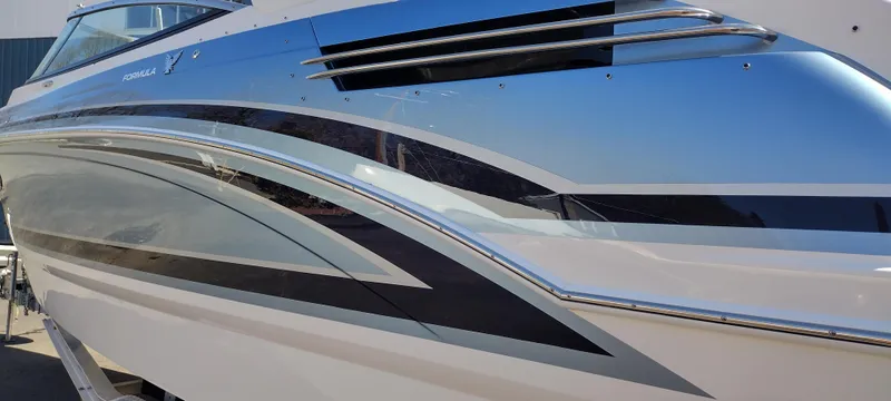 Slide: The Image of 2024 Formula 290 BR boat with sleek, modern design and metallic accents. - 11