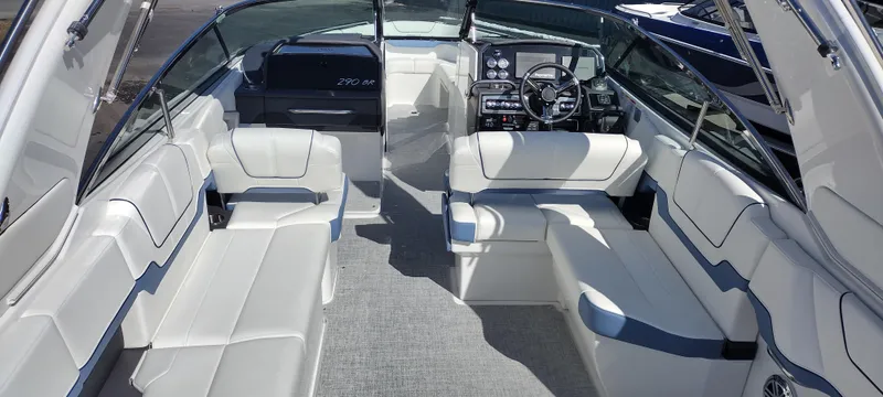 Slide: The Image of 2024 Formula 290 BR boat interior with spacious seating and modern dashboard. - 12