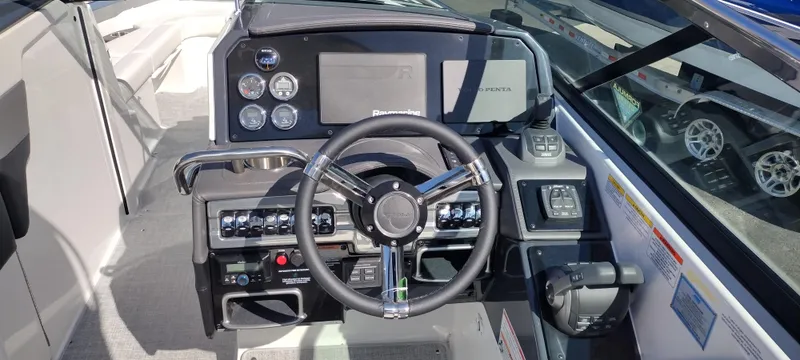 Slide: The Image of 2024 Formula 290 BR boat dashboard with steering wheel and control panel. - 13