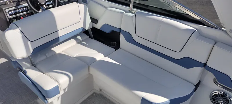 Slide: The Image of 2024 Formula 290 BR boat interior with white and blue seating. - 21