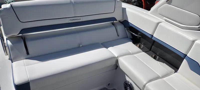 Slide: The Image of 2024 Formula 290 BR boat interior with luxurious white seating and modern design. - 22