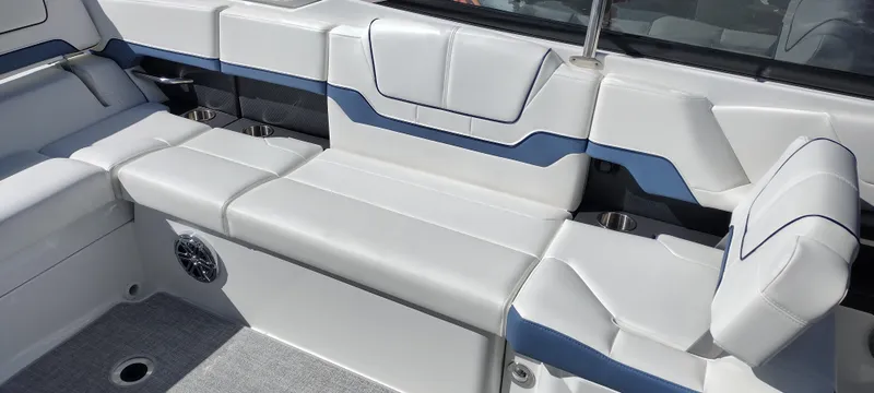 Slide: The Image of 2024 Formula 290 BR boat interior with white and blue seating. - 23