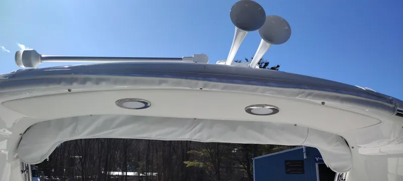 Slide: The Image of 2024 Formula 290 BR boat canopy with speakers and blue sky background. - 24