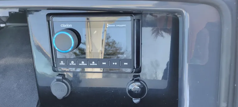 Slide: The Image of Clarion audio system in 2024 Formula 290 BR boat dashboard. - 25