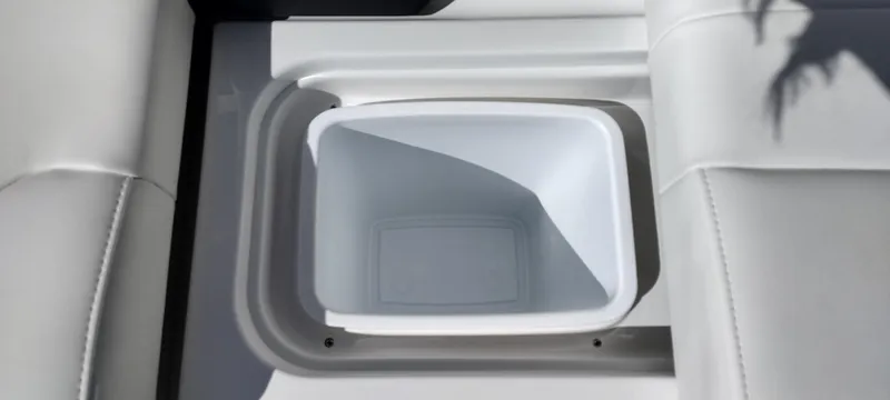 Slide: The Image of 2024 Formula 290 BR boat cooler compartment with white interior. - 29