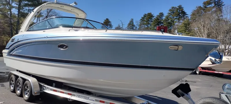 Slide: The Image of 2024 Formula 290 BR boat on trailer, sleek design, parked outdoors. - 3