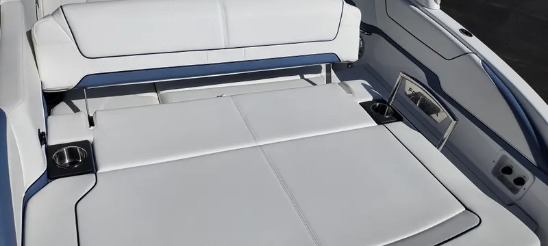 Slide: The Image of 2024 Formula 290 BR boat interior with white seating and cup holders. - 31