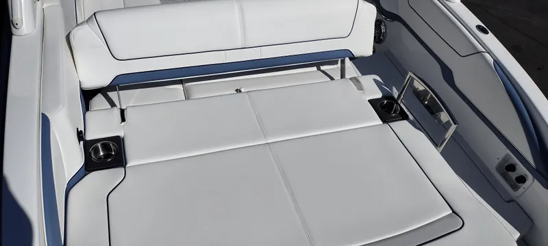 Slide: The Image of 2024 Formula 290 BR boat interior with white seating and cup holders. - 32