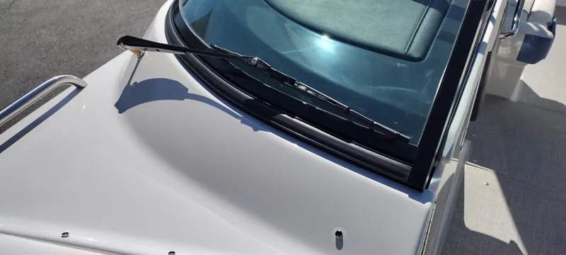 Slide: The Image of 2024 Formula 290 BR boat windshield and deck detail in sunlight. - 38