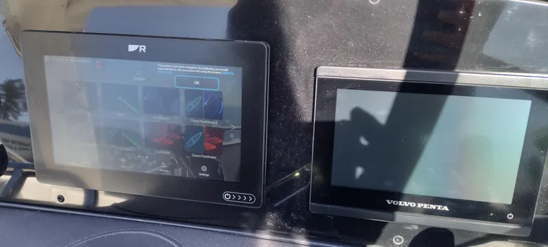 Slide: The Image of Dashboard of a 2024 Formula 290 BR boat with digital displays. - 39