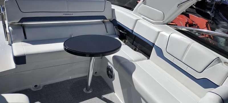 Slide: The Image of 2024 Formula 290 BR boat interior with seating and table. - 41