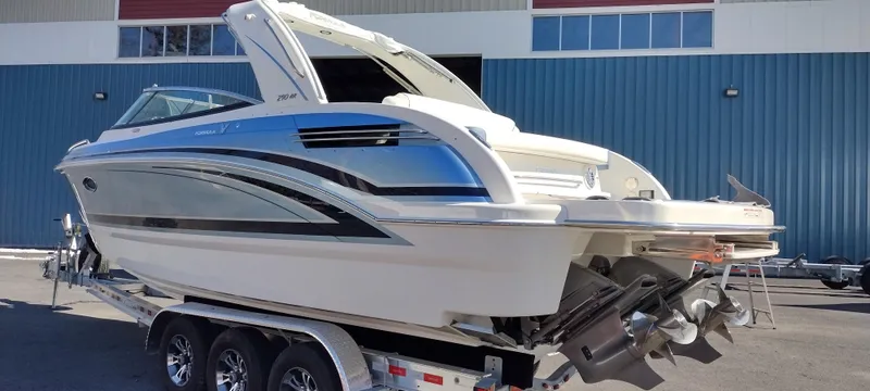Slide: The Image of 2024 Formula 290 BR boat on trailer, sleek design, parked outdoors. - 7