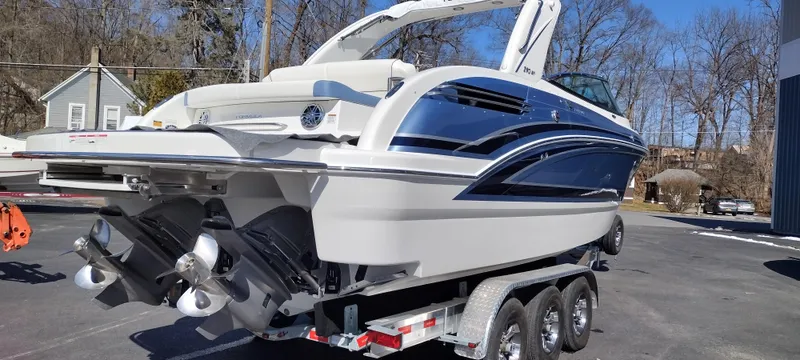 Slide: The Image of 2024 Formula 290 BR boat on trailer, sleek design, dual engines, parked outdoors. - 8