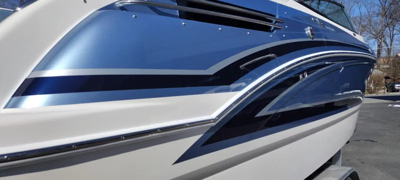 Slide: The Image of 2024 Formula 290 BR boat with sleek blue and white design. - 9