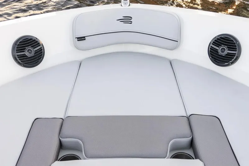 Slide: The Image of 2025 Bayliner VR5 Bowrider OB with spacious seating and canopy, parked outdoors. - 4