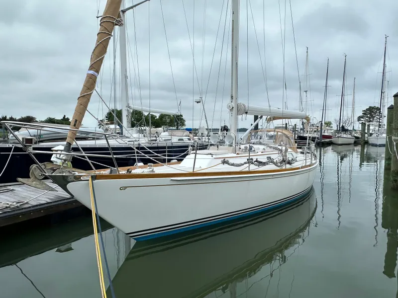 Slide: The Image of 1987 Hinckley Sou'wester 42 sailboat docked in a marina, overcast sky. - 14