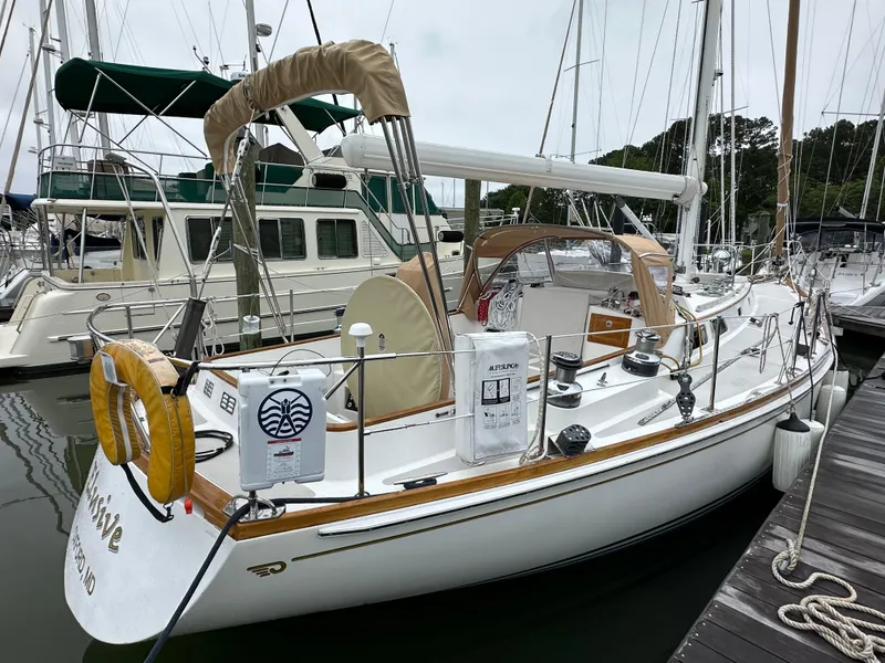 Slide: The Image of 1987 Hinckley Sou'wester 42 sailboat docked at marina, featuring classic design and elegant lines. - 15