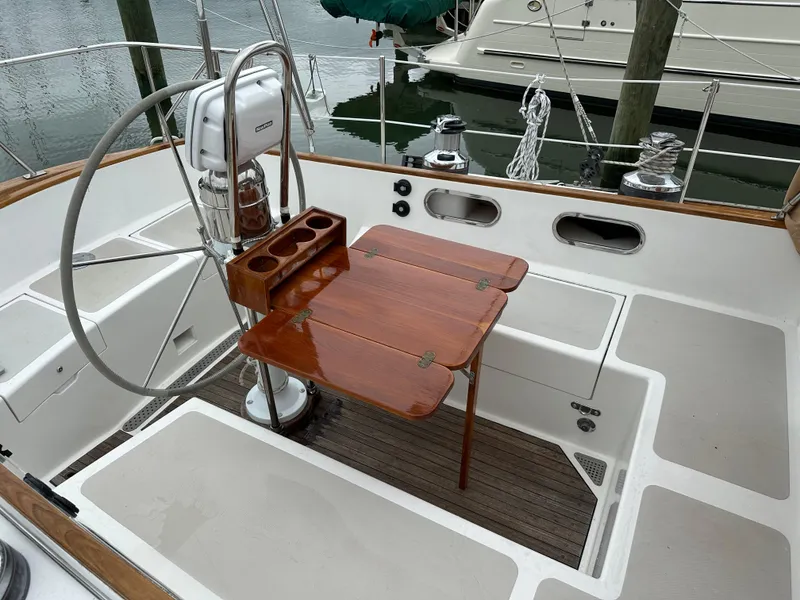 Slide: The Image of Cockpit of 1987 Hinckley Sou'wester 42 sailboat with wooden table and steering wheel. - 26