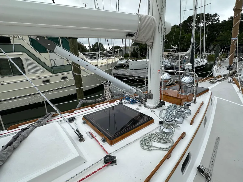 Slide: The Image of 1987 Hinckley Sou'wester 42 sailboat deck with winches and rigging in a marina. - 28