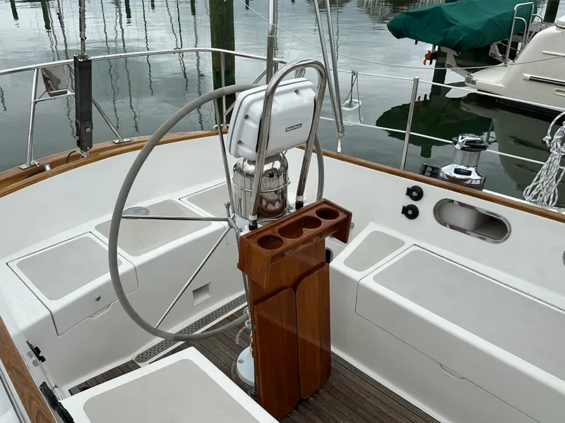 Slide: The Image of Cockpit of 1987 Hinckley Sou'wester 42 sailboat with steering wheel and wooden console. - 30
