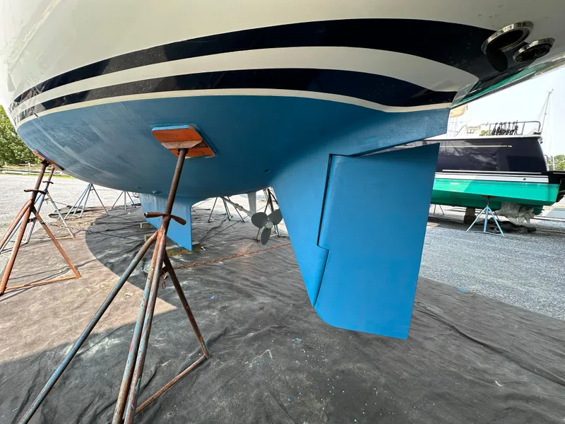 Slide: The Image of Hinckley Sou'wester 42 sailboat hull and rudder, 1987 model, on stands for maintenance. - 35