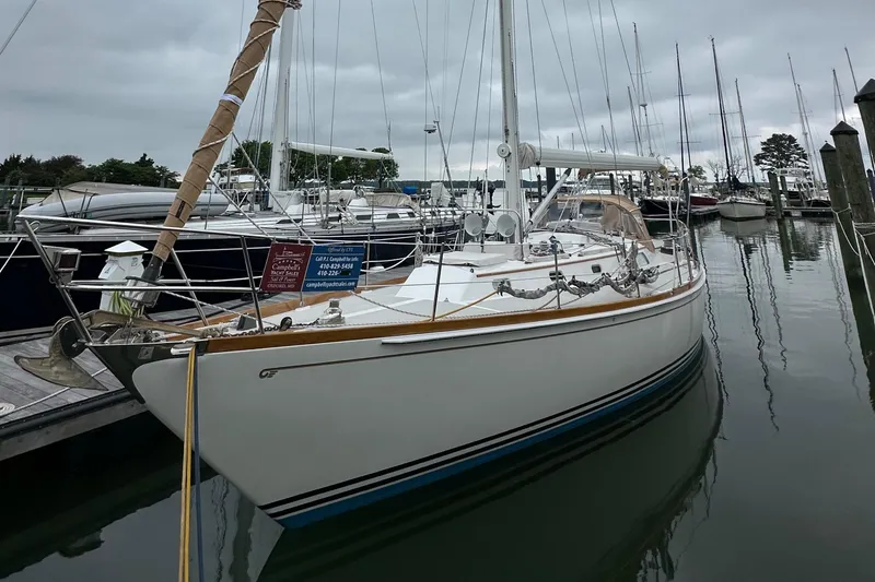 Slide: The Image of 1987 Hinckley Sou'wester 42 sailboat docked in a marina, overcast sky. - 36