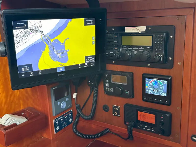 Slide: The Image of Navigation equipment on 1987 Hinckley Sou'wester 42 sailboat, featuring Garmin GPS and marine radio. - 4