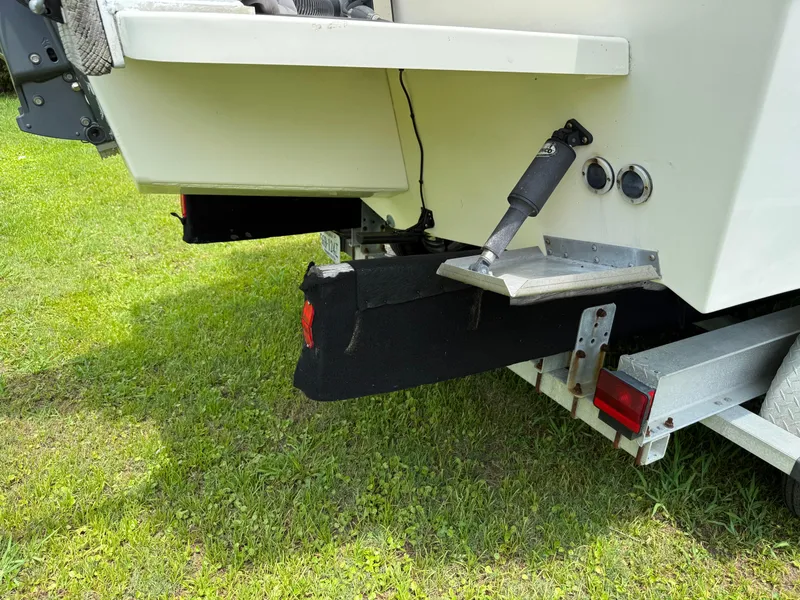Slide: The Image of Rear view of a 2002 Parker 2510 Walkaround boat on a trailer. - 4