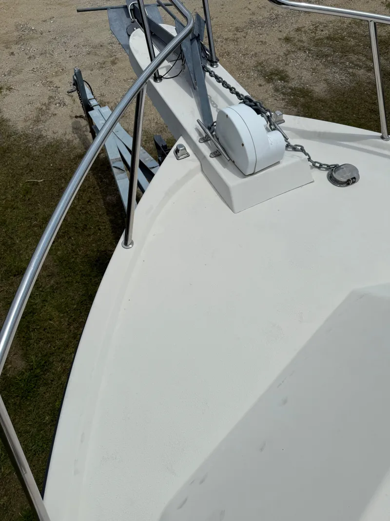 Slide: The Image of Bow of 2002 Parker 2510 Walkaround boat with anchor and railing. - 9