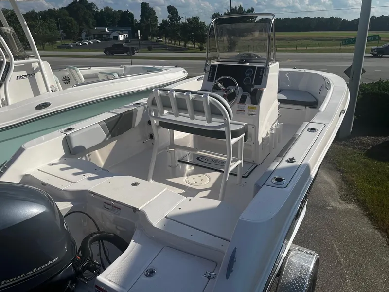 Slide: The Image of 2025 Robalo R180 Center Console boat with spacious deck and modern controls. - 16