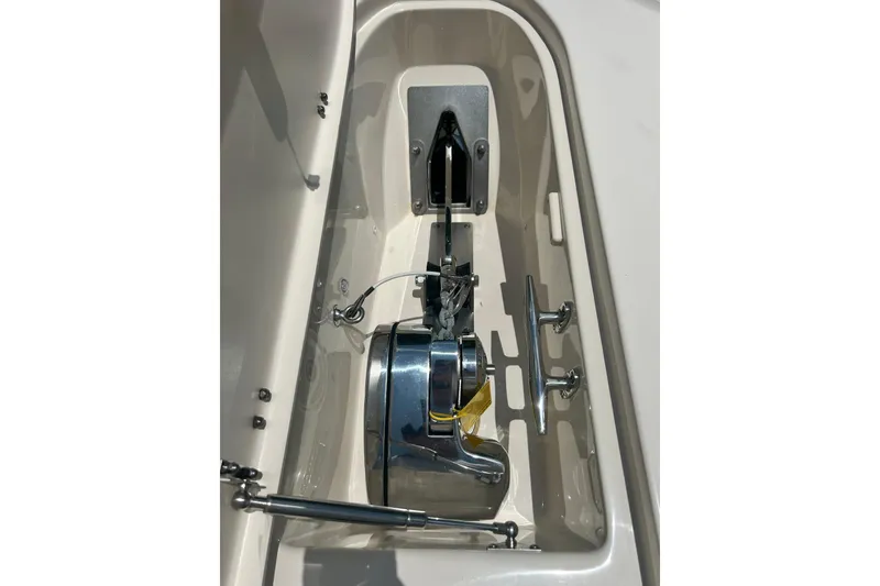 Slide: The Image of Anchor compartment of 2020 Grady-White Freedom 307 boat, featuring stainless steel hardware. - 21