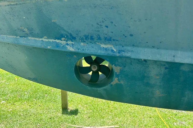 Slide: The Image of 2020 Grady-White Freedom 307 boat hull with visible propeller detail. - 6